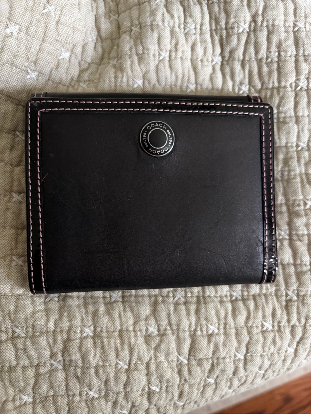 Coach Black Leather Bifold Wallet with Pink Contrast Stitching